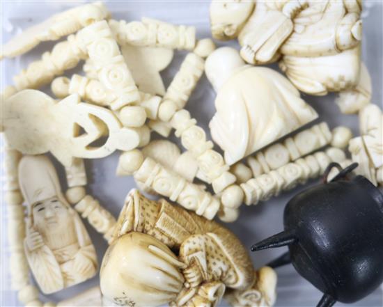 Five ivory netsukes and a bone necklace